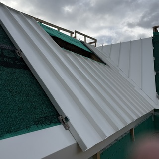 Metal roof installation in progress